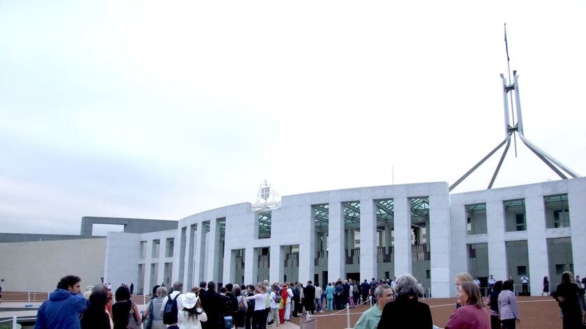 Members of the public queue to get into Parliament House