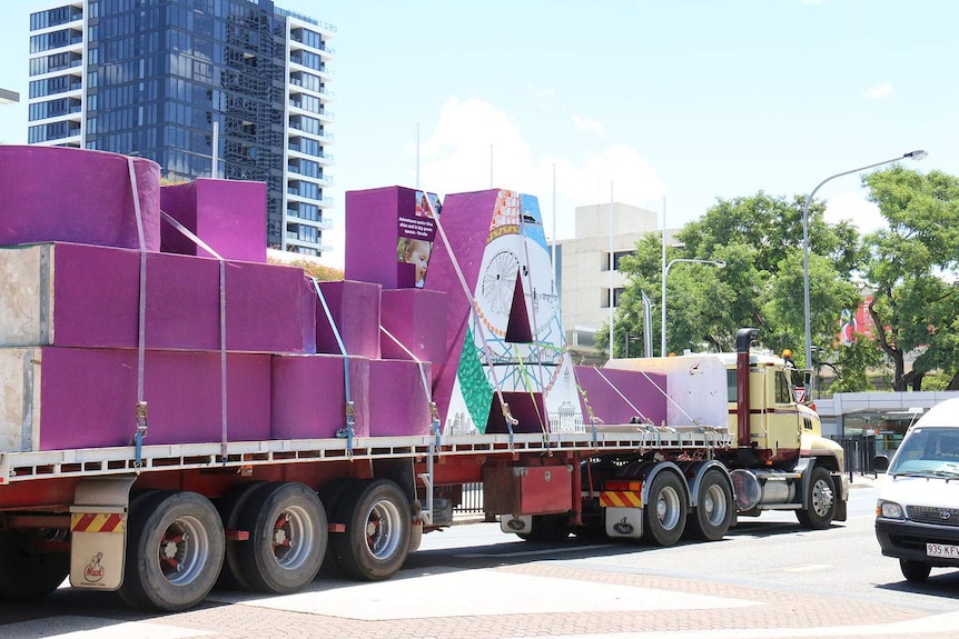 A truck carries the Brisbane sign away from South Bank.