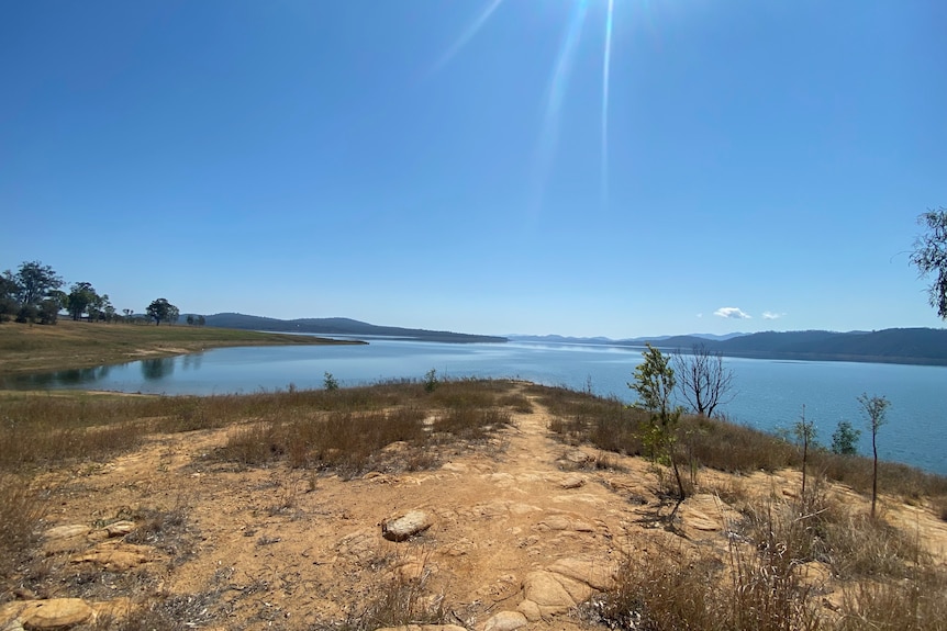 Winenhoe Dam on a sunny day in dry condition as water levels fall