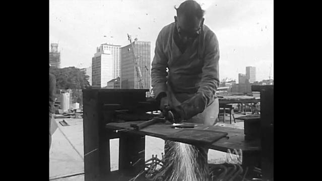Old photo of man welding steel