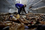 Man cleans up looted store in Caracas