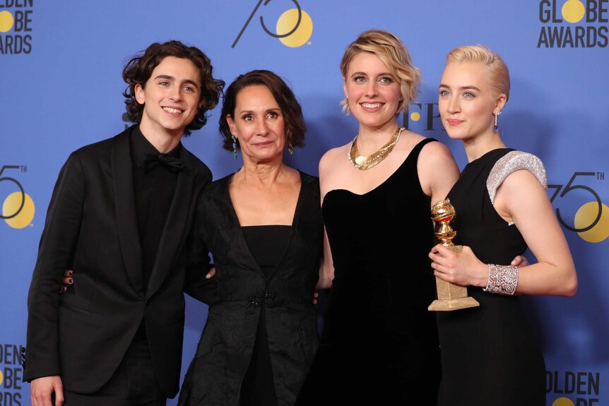 Director Greta Gerwig poses with the stars of her film Lady Bird at the Golden Globes.