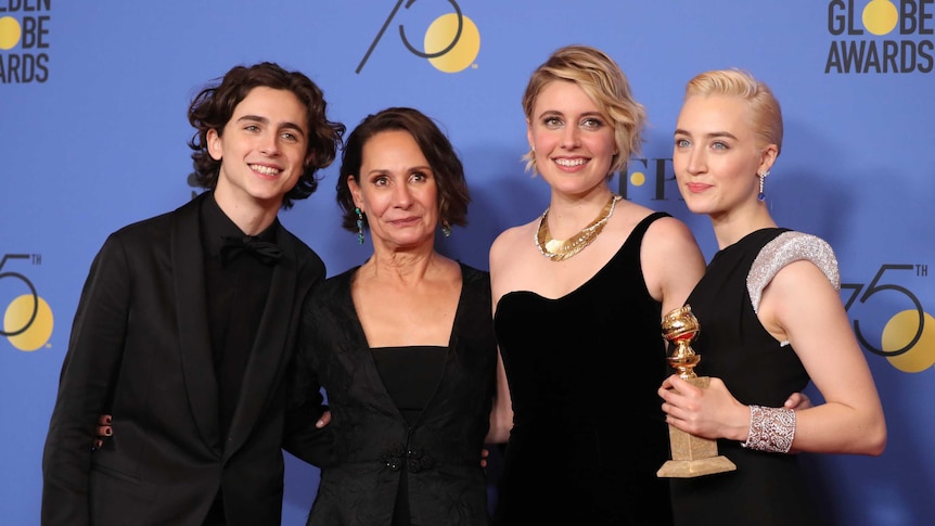 Director Greta Gerwig poses with the stars of her film Lady Bird at the Golden Globes.
