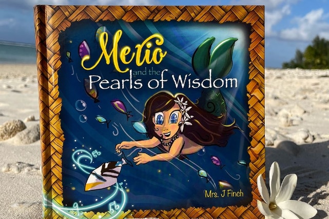 The book cover of Merio and the Pearls of Wisdom shows a mermaid with dark hair and a green tail swimming after a fish
