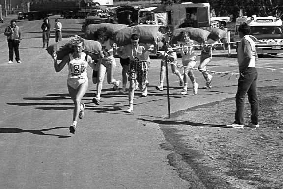 black and white image women running in race