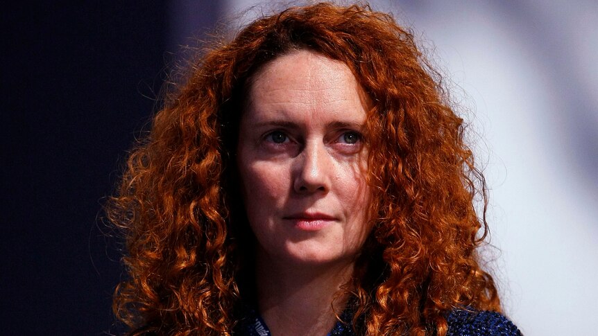 Rebekah Brooks holds papers