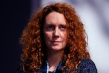 Rebekah Brooks holds papers