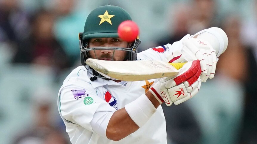 Pakistan batsman Yasir Shah watches a cricket ball come off his bat during a Test against Australia.