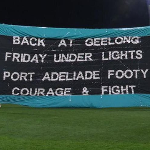 black football banner with white writing misspelling Adelaide
