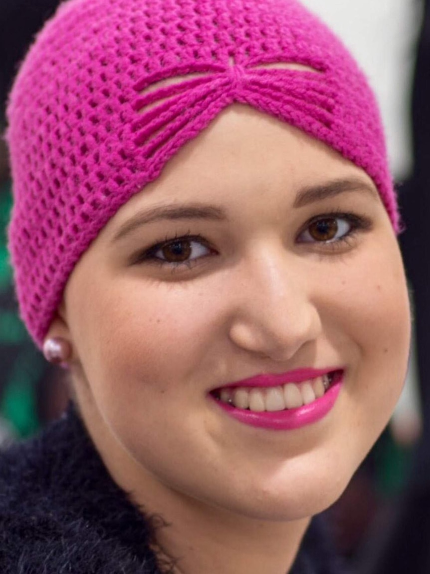 Demi Bettini wears a pink headscarf in a photo taken during her chemotherapy treatment in 2015.