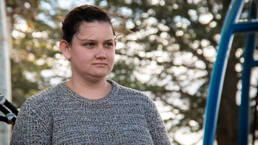 PTSD sufferer Elizabeth Veasey looks on at a playground.