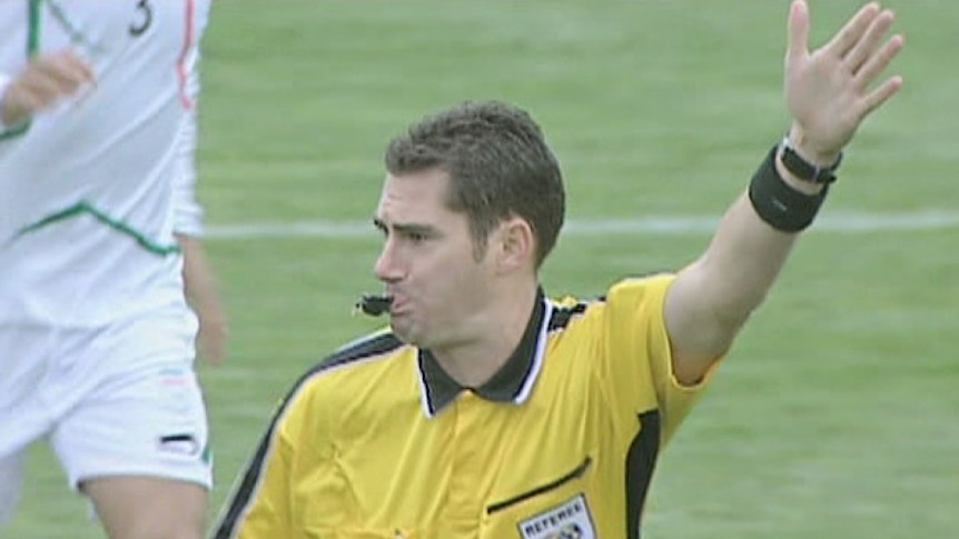 Australian referee Ben Williams blows the whistle during a FIFA match.