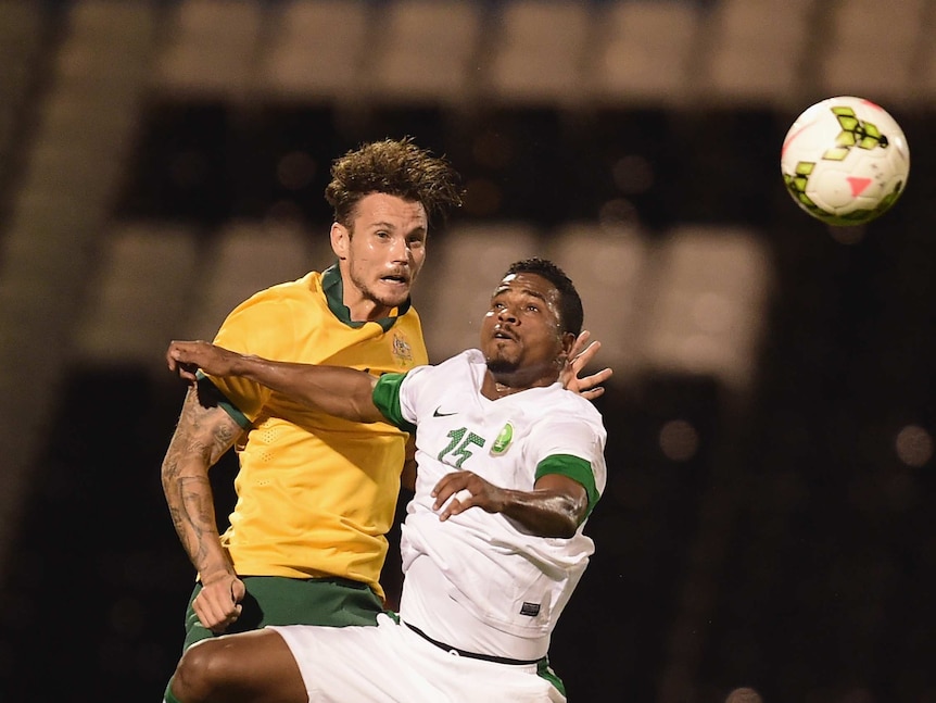 Chris Herd of Australia battles with Nassir Alshamrani of Saudi Arabia