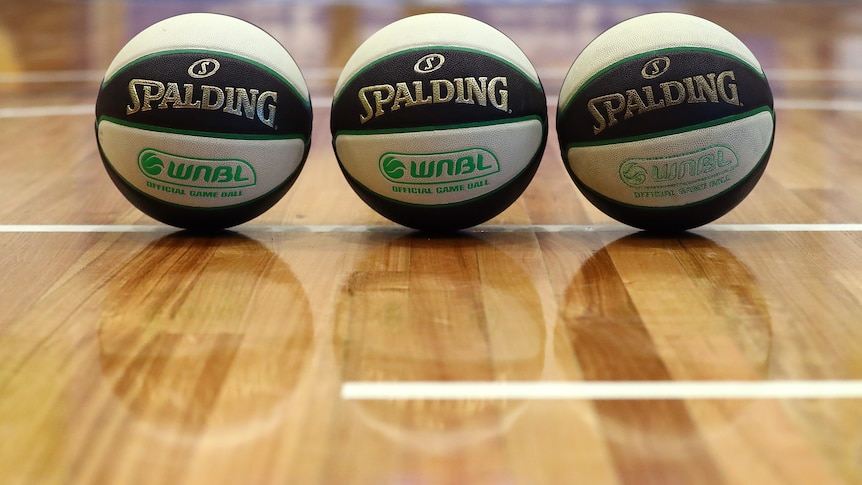 Three WNBL basketballs lined up next to each other.