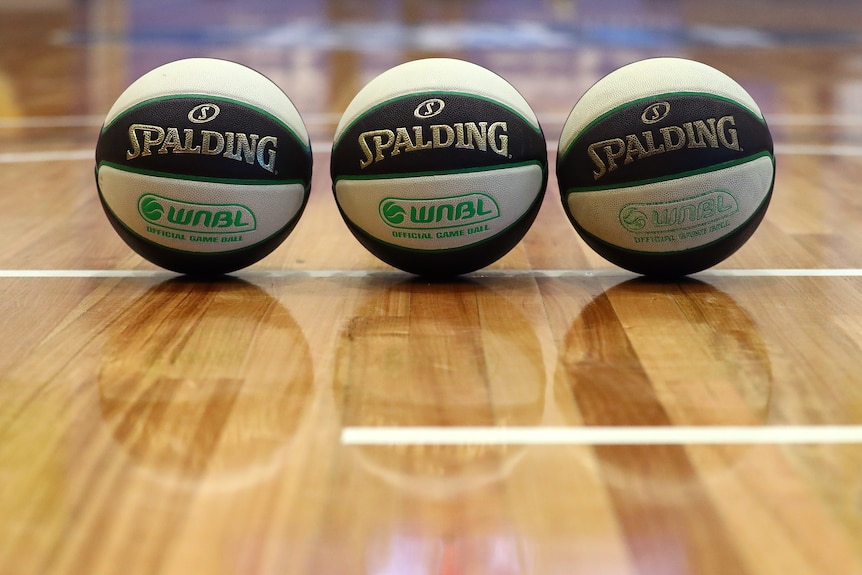 Three WNBL basketballs lined up next to each other.