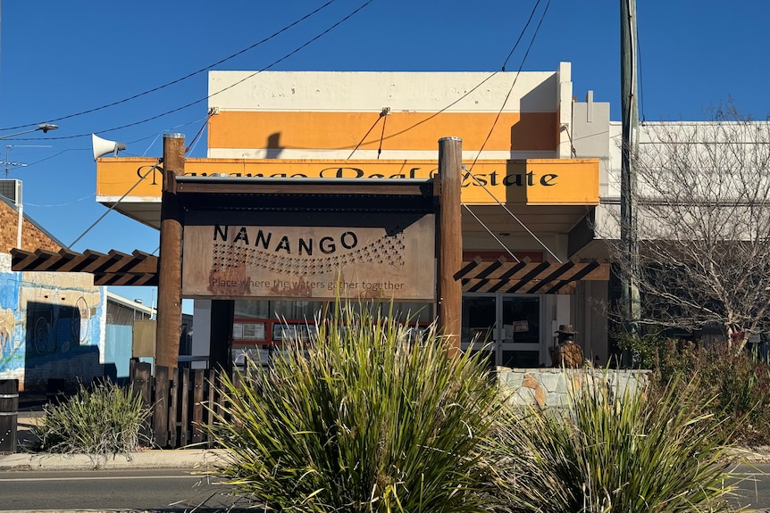 A tall rustic looking sign with 'nanango' standing for residents and visitors to see