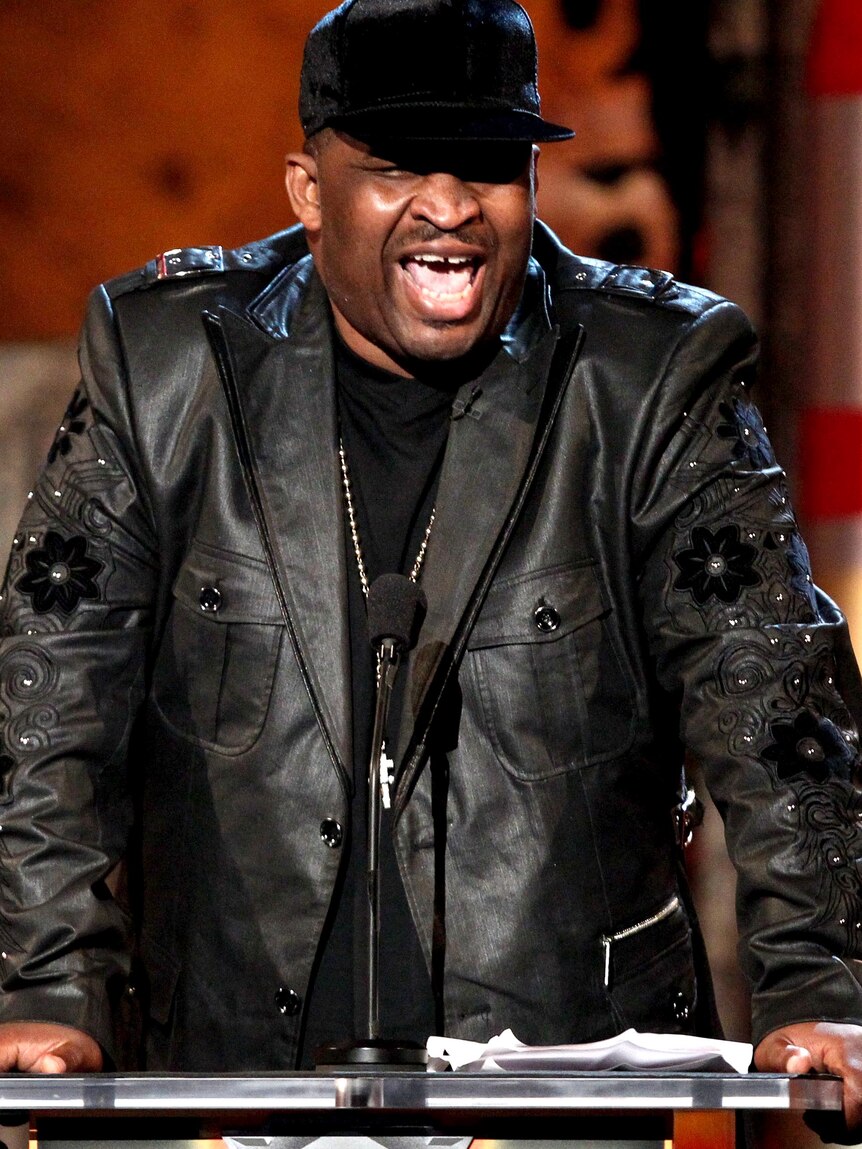 Comedian Patrice O'Neal speaks onstage.