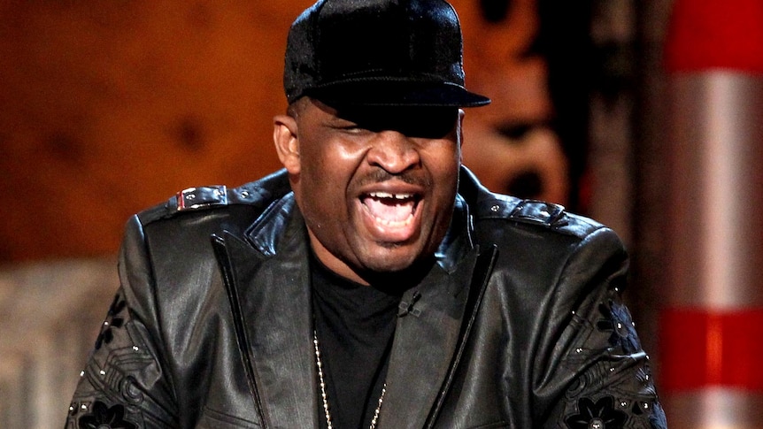 Comedian Patrice O'Neal speaks onstage.
