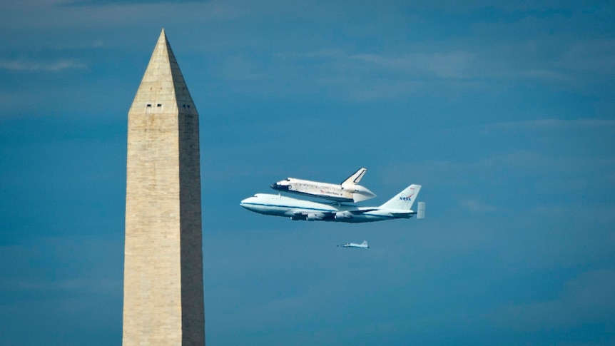 The space shuttle Discovery is taken to last resting place at the National Air and Space museum.