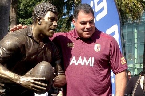 Mal Meninga with his statue at Lang Park.