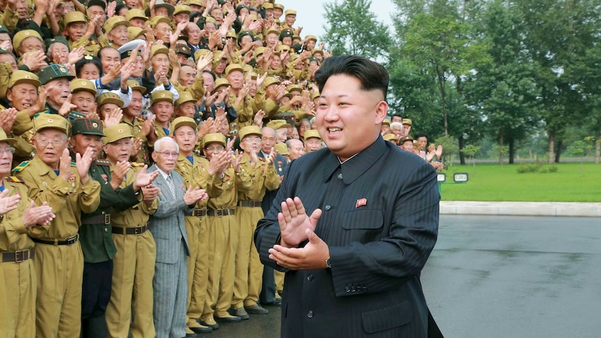 Kim Jong-un with war veterans