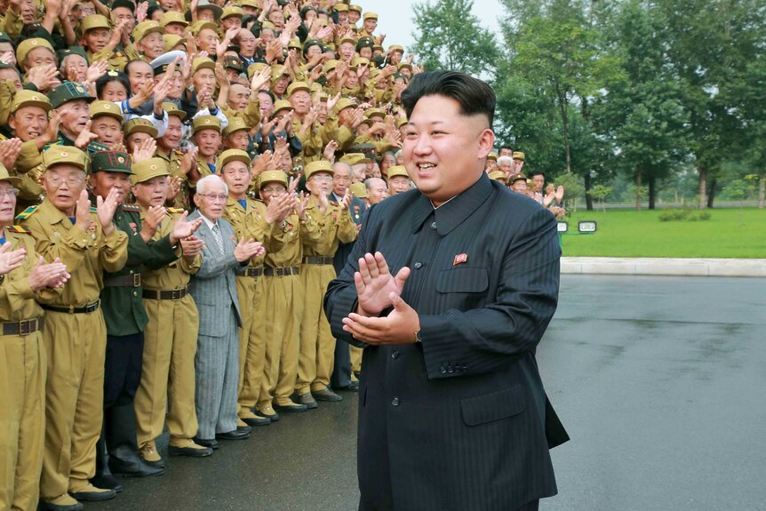 Kim Jong-un with war veterans