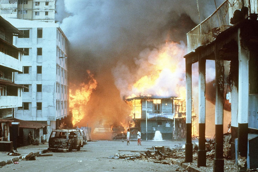 Building being engulfed by flames.