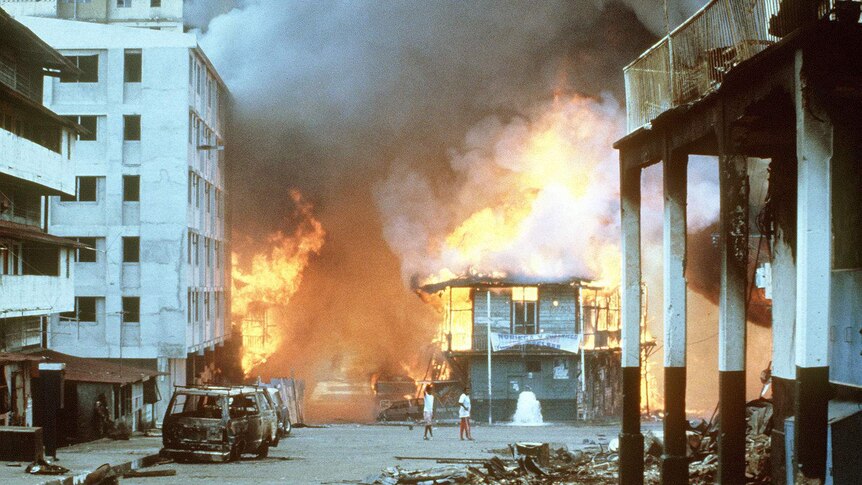 Building being engulfed by flames.