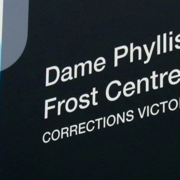 A close up of a sign that reads 'Dame Phyllis Frost Centre, Corrections Victoria'.