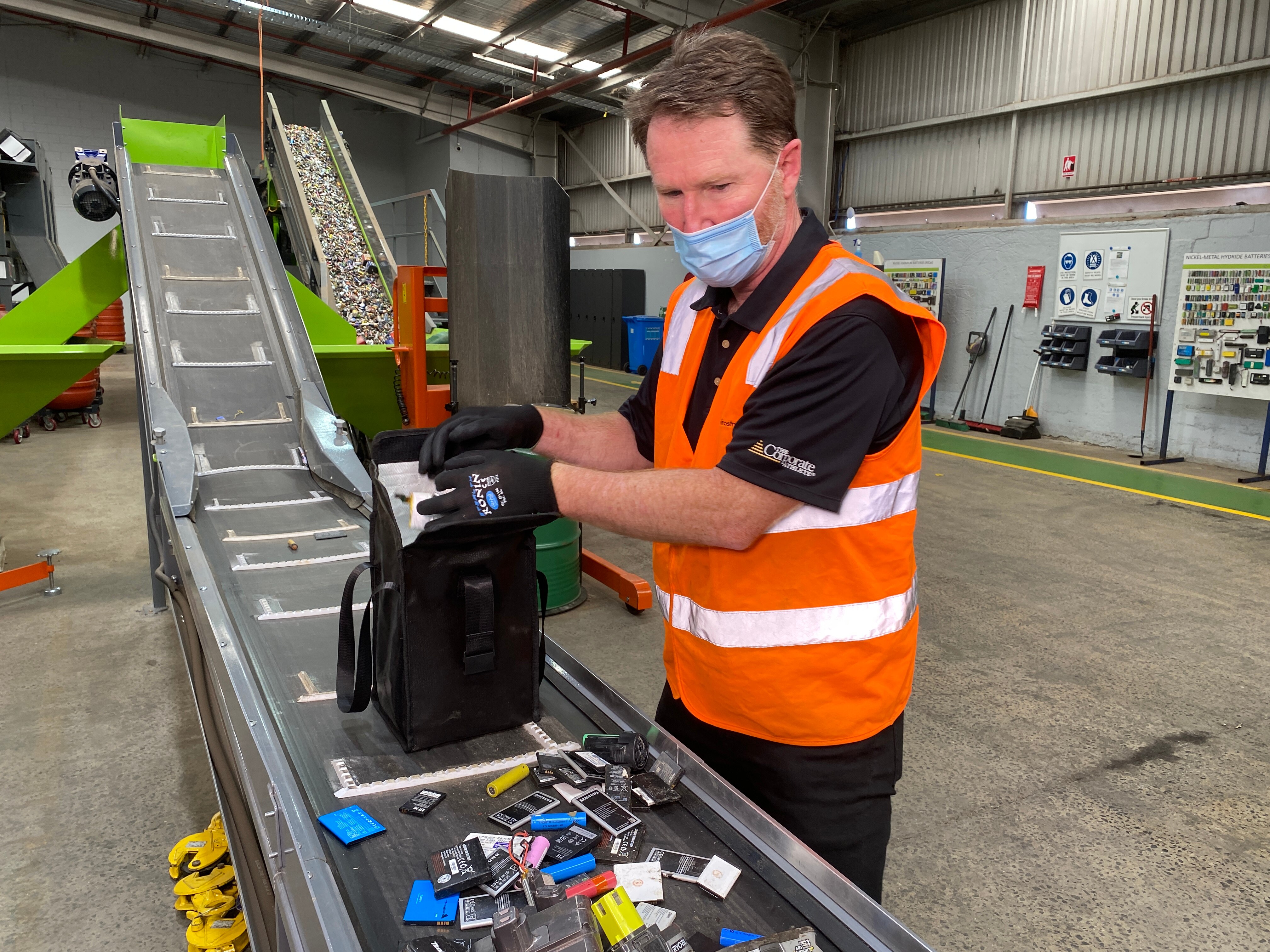 a man in high vis with batteries