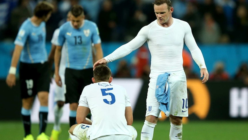Rooney consoles Gary Cahill after Uruguay loss