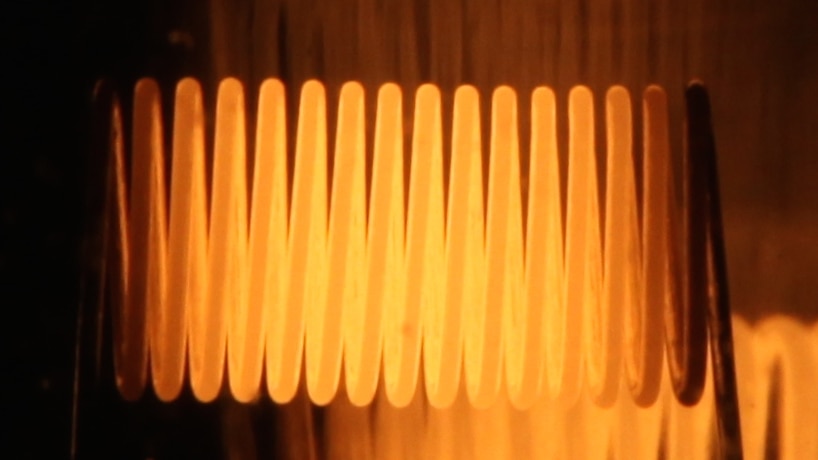 A close-up photograph of an electric light filament