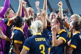 The Matildas celebrate Olympic football qualification after they beat North Korea in Osaka.