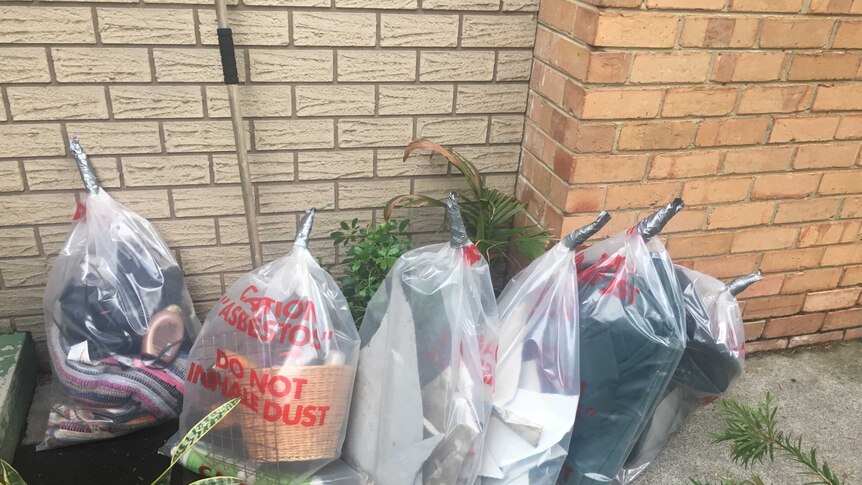 Bags of items affected by asbestos dust