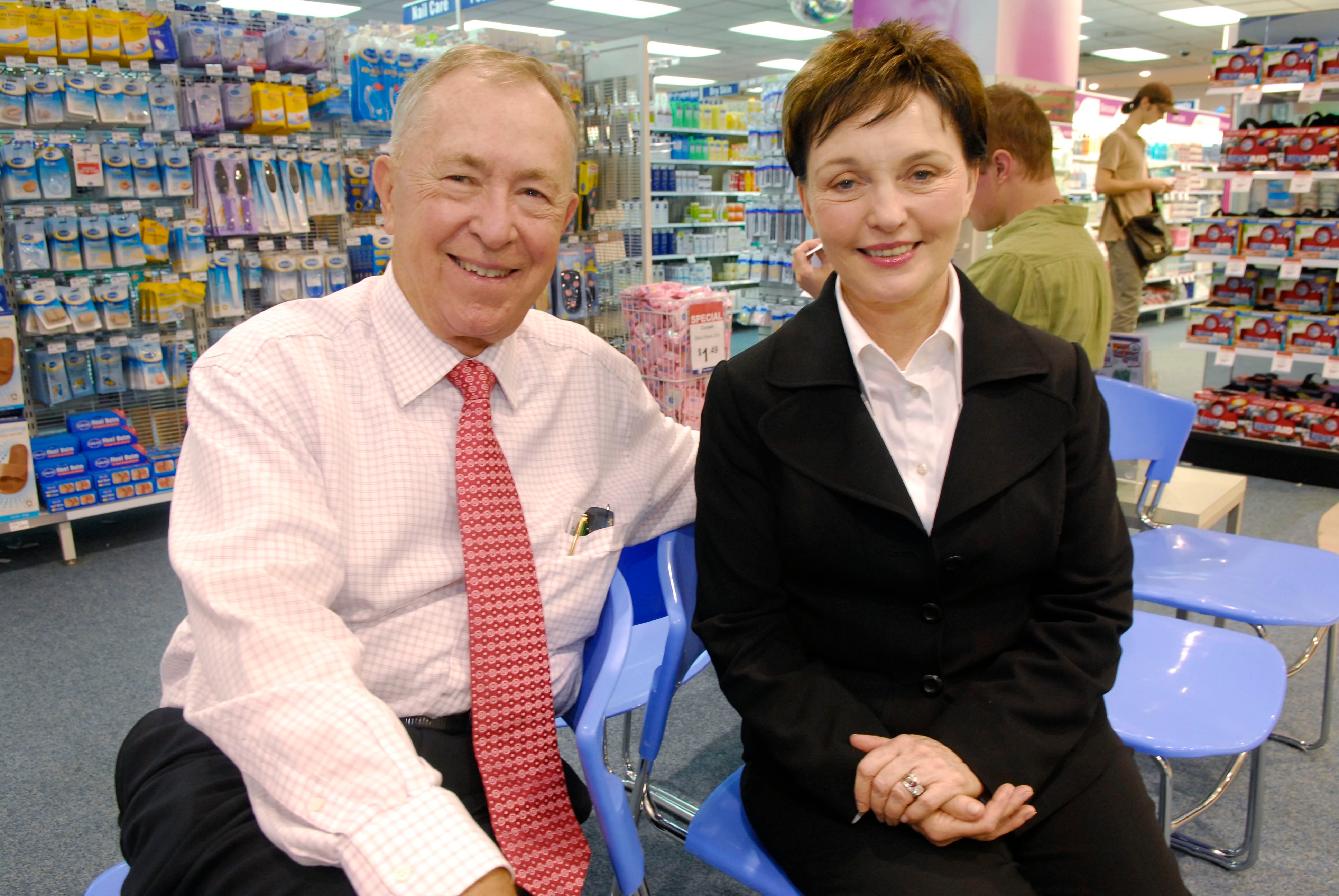 An elderly couple in a pharmacy