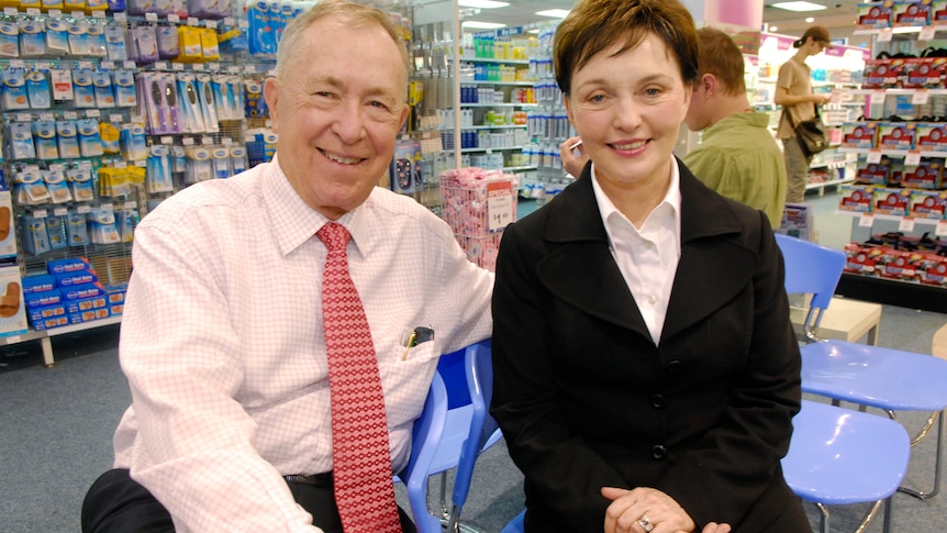 An elderly couple in a pharmacy