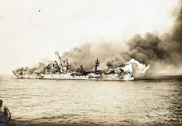 A historical photo of a steamer ablaze on the western front.