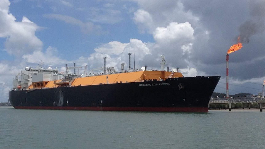 An LNG ship docked at a port.