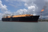 An LNG ship docked at a port.