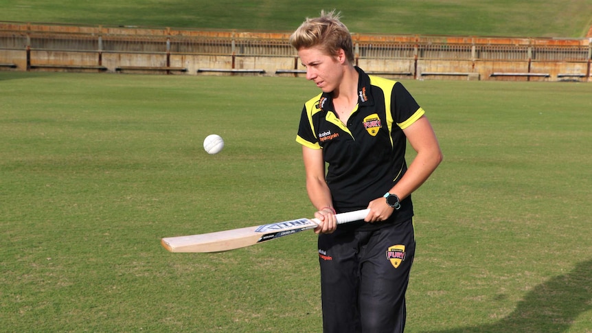 Australian cricketer Elyse Villani bounces a cricket ball on a bat at the WACA Ground in Perth.
