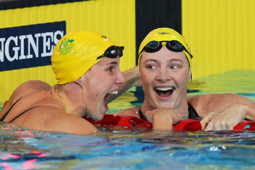 Cate and Bronte Campbell celebrate after 100m freestyle in Glasgow