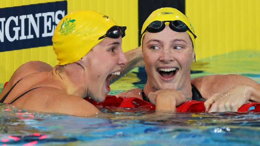 Cate and Bronte Campbell celebrate after 100m freestyle in Glasgow