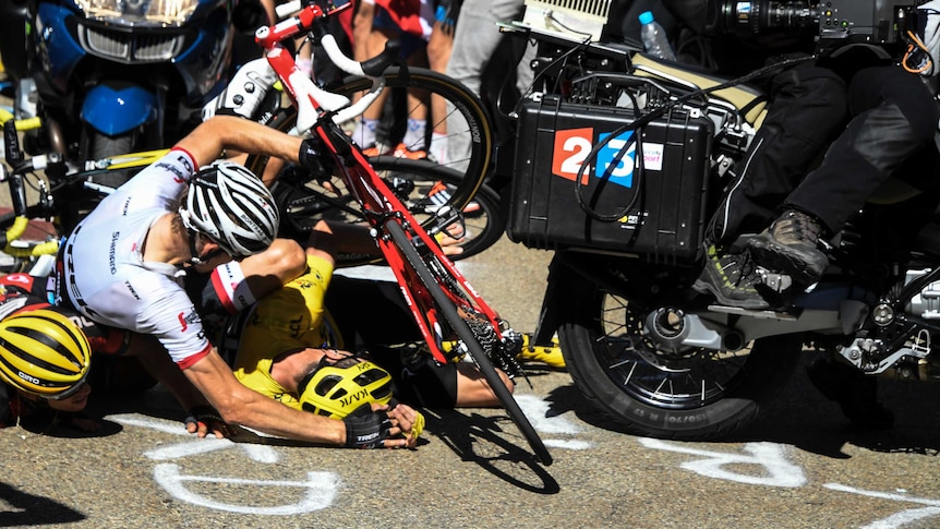 L to R, Richie Porte, Bauke Mollema and yellow jersey holder Chris Froome crash at Tour de France.