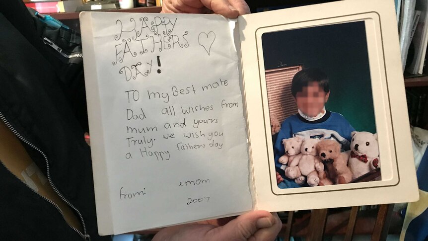 A birthday card with 'happy father's day to my best mate' and a picture of James as a boy, holding four teddies.