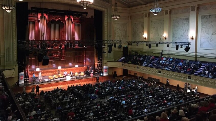 Audiences fill the inside of Melbourne Town Hall.