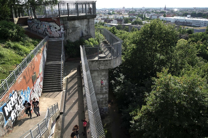 Climbers scale the Flakturm III in Berlin’s Humboldthain Park