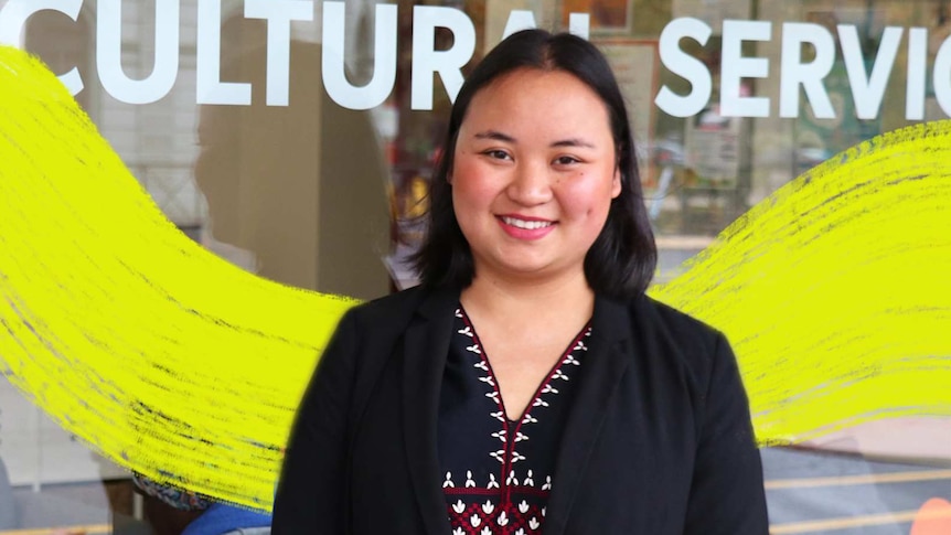 Bu Gay Pah Thei standing in front of her workplace for a story about how communities are helping refugees settle in Australia