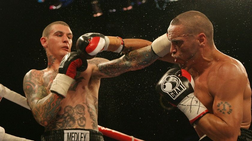 Medley wears a right hook from Mundine.
