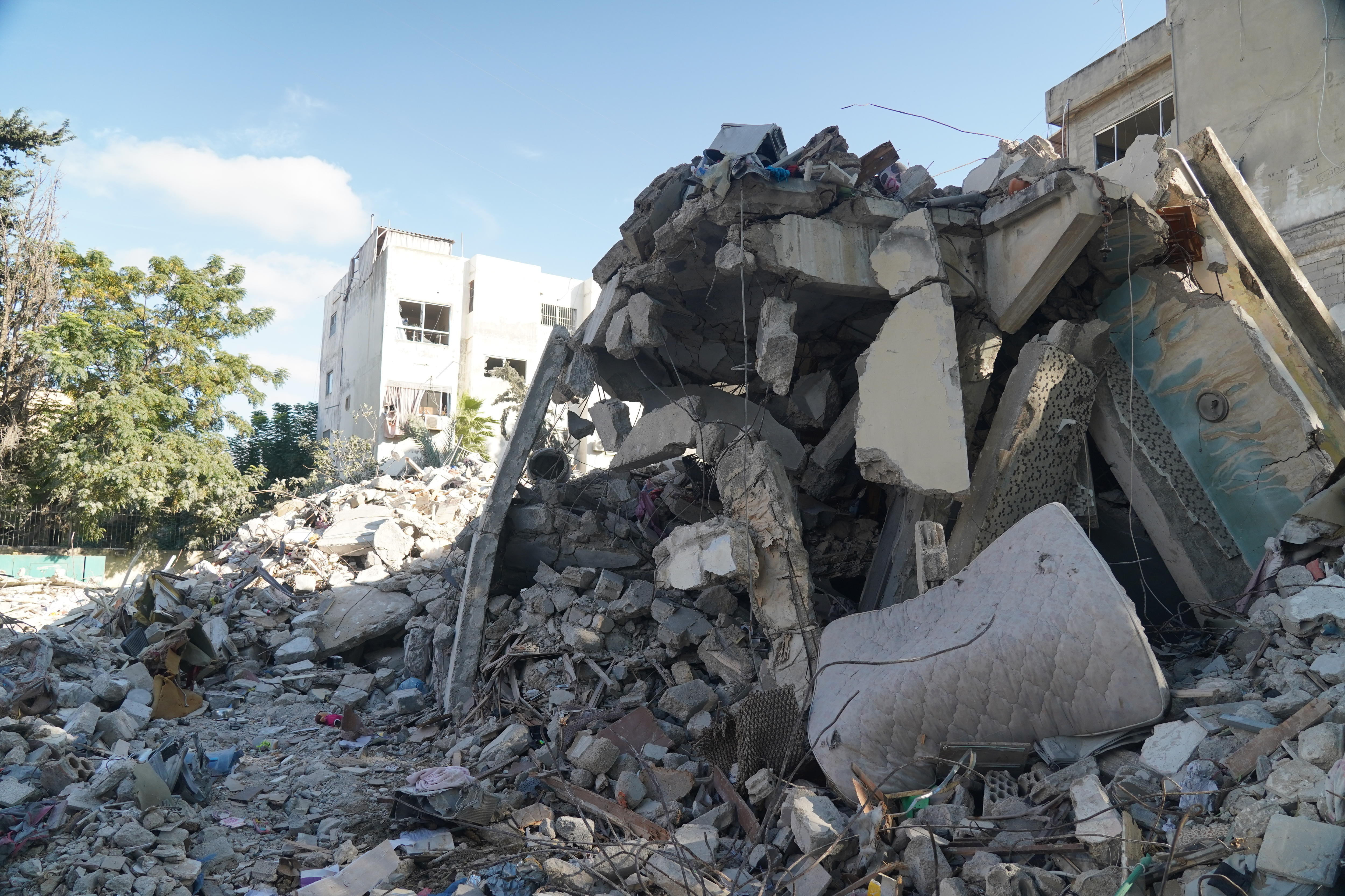 Rubble from a destroyed building on a town street