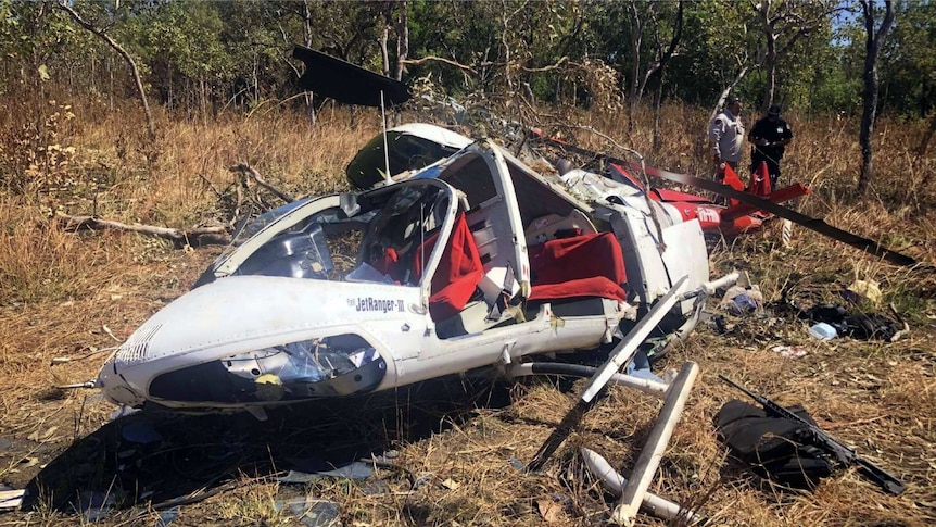 A photo of a helicopter wreckage in remote terrain in Kakadu National Park.
